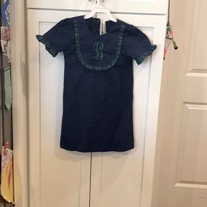 ‘L’ monogrammed Navy dress with green ruffles